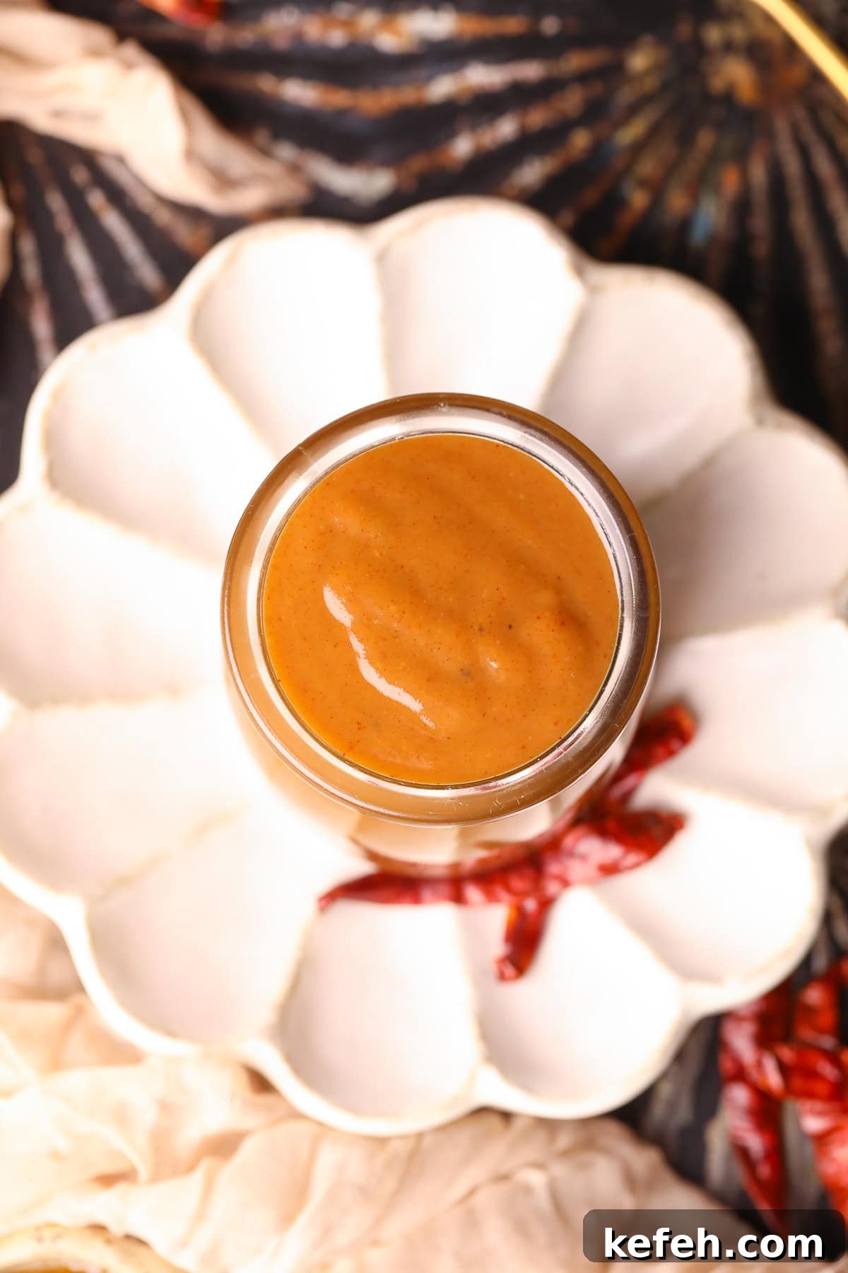 Memphis Honey Gold BBQ Sauce Recipe 5 memphis honey gold sauce in a glass jar with a gold spoon.