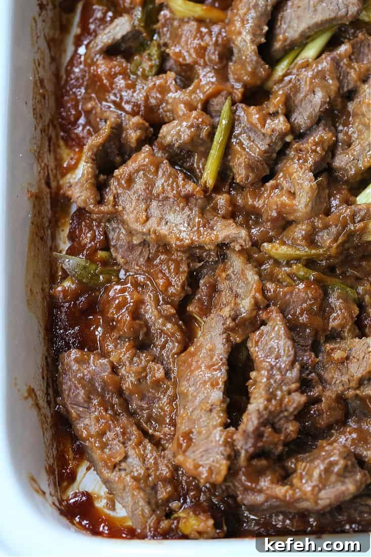 Slow Cooker Mongolian Beef in a crock pot with sauce