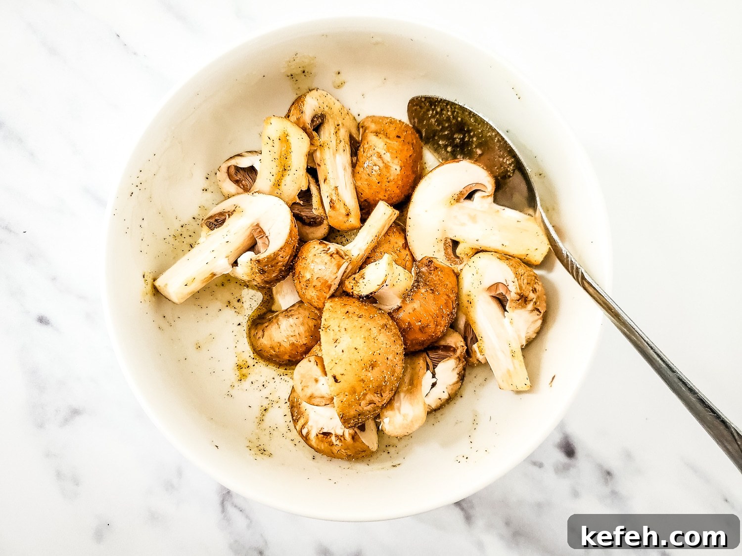 Bella mushrooms in a bowl with garlic