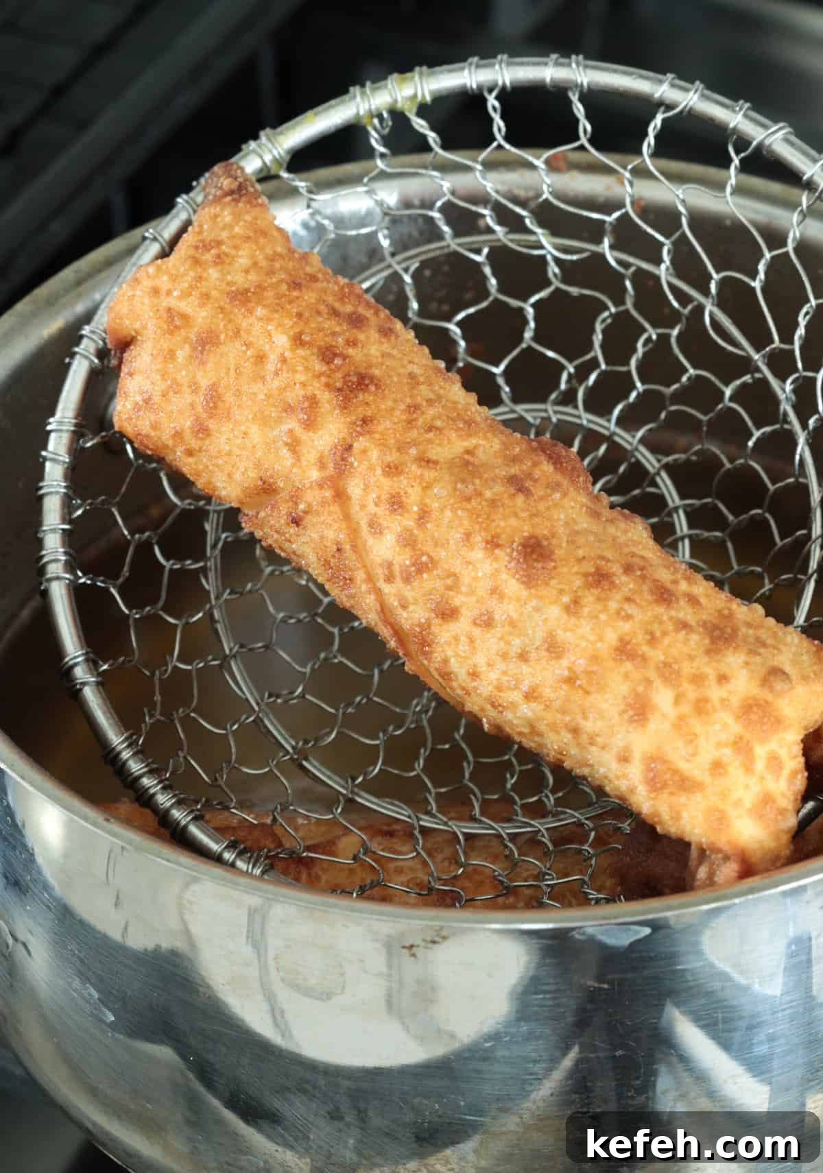 Fried buffalo chicken egg roll in spider.