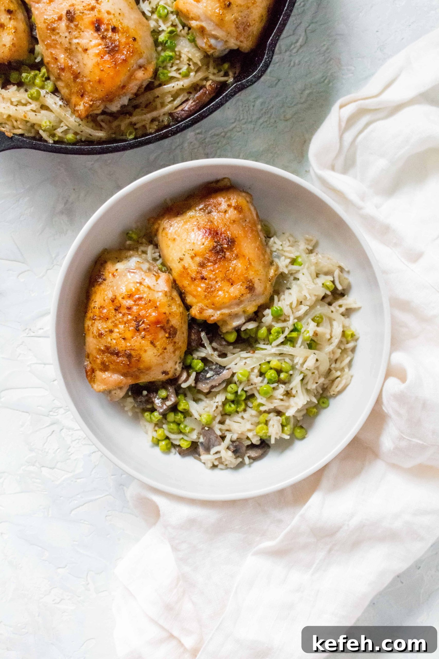 Skillet Chicken with Mushrooms, Peas & Creamy Rice 2 Grab your cast iron and make this one pot crispy and juicy chicken thighs with mushroom, onions, and pea rice tonight!