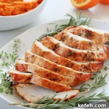 Juicy Air Fryer Turkey Breast Recipe for Quick Weeknight Meals 7 Turkey breast on a white plate.