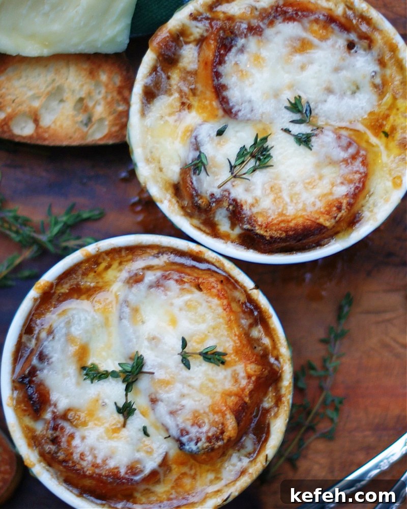 French Onion Soup with Cheese and crusty bread on top