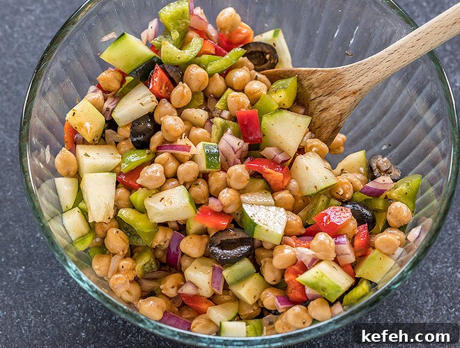 Mediterranean Chickpea Salad with Feta, Cucumber & Lemon Dressing 6 bowl with chickpeas, chopped onion,olives, cucumber and pepper