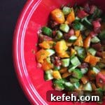 Last-Minute Rosh Hashanah Prep: Quick Guide to Ready Your Home and Table 20 cucumber tomato salad in red bowl cropped for feature image size