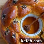 Last-Minute Rosh Hashanah Prep: Quick Guide to Ready Your Home and Table 25 Round challah with a honey ramekin in the center.