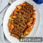Last-Minute Rosh Hashanah Prep: Quick Guide to Ready Your Home and Table 5 platter of sliced brisket with potatoes and carrots with serving fork and gravy pitcher