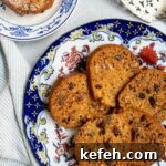 Last-Minute Rosh Hashanah Prep: Quick Guide to Ready Your Home and Table 41 Slices of honey cake on a large plate with a single slice in the upper left with powdered sugar on it.
