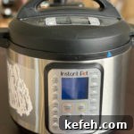 Last-Minute Rosh Hashanah Prep: Quick Guide to Ready Your Home and Table 6 photo of instant pot 6 quart with OMG! Yummy logo on it