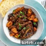 Last-Minute Rosh Hashanah Prep: Quick Guide to Ready Your Home and Table 7 Braised beef brisket in a bowl with a slice of challah on the side.