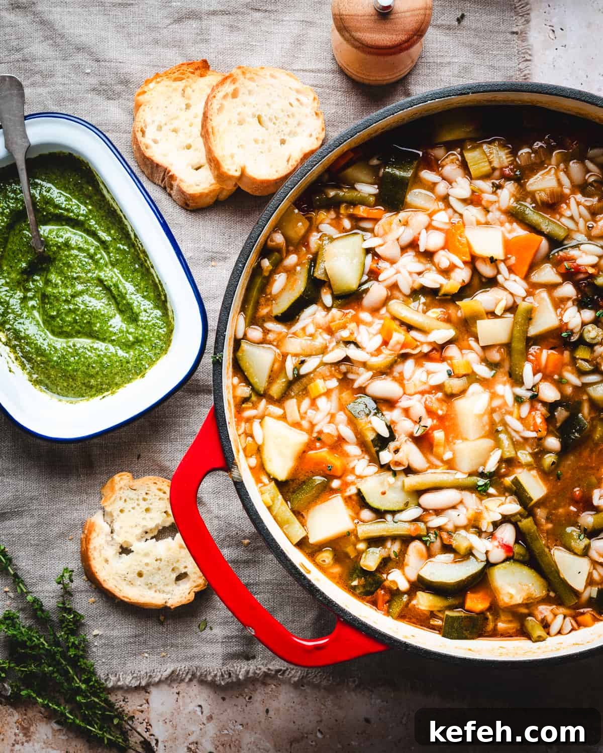 Classic French Pistou Soup Recipe: Provençal Vegetable Stew with Basil 6 Soupe au Pistou in a large pot with a bowl of pistou nearby.