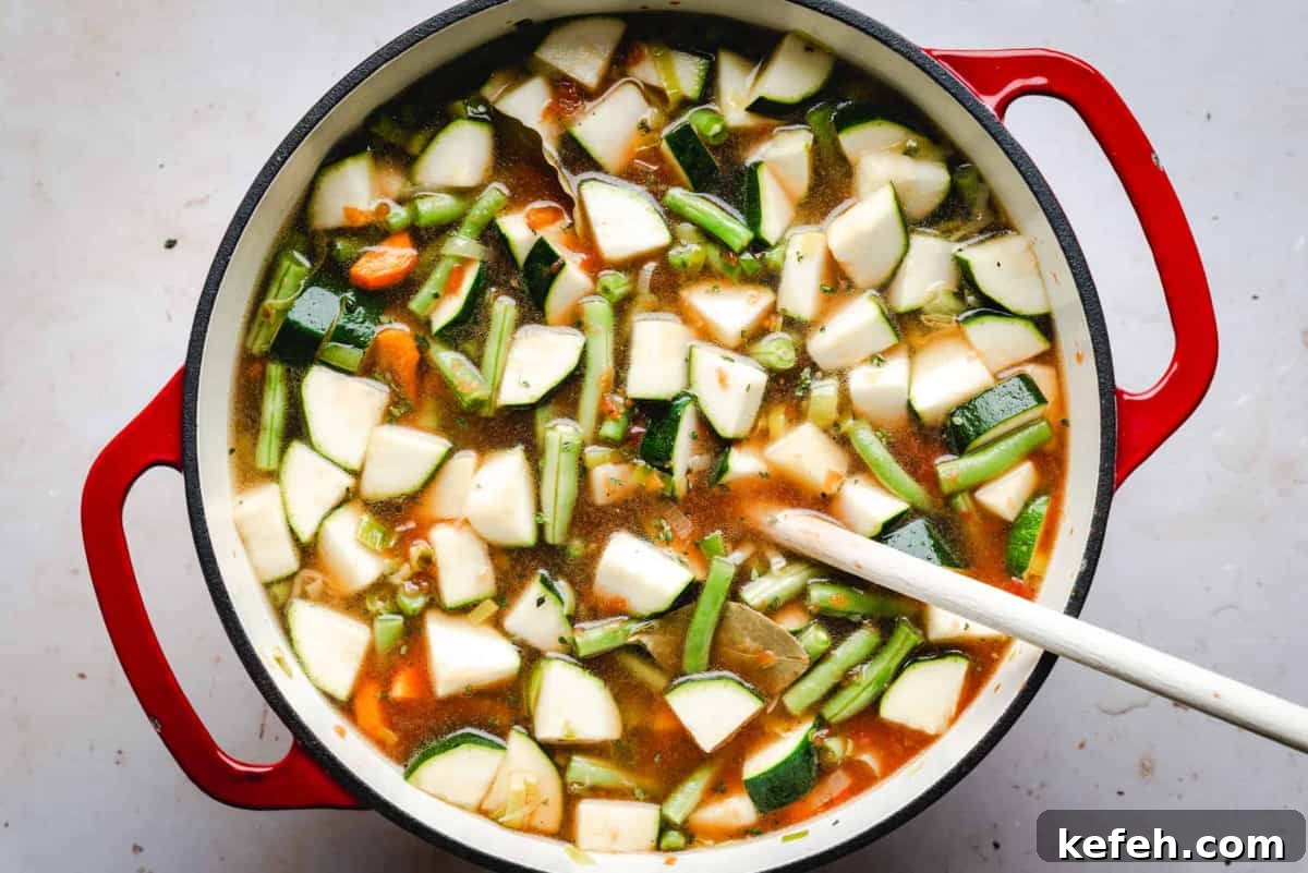 Classic French Pistou Soup Recipe: Provençal Vegetable Stew with Basil 10 soup ingredients in a pot ready to bring to simmer.