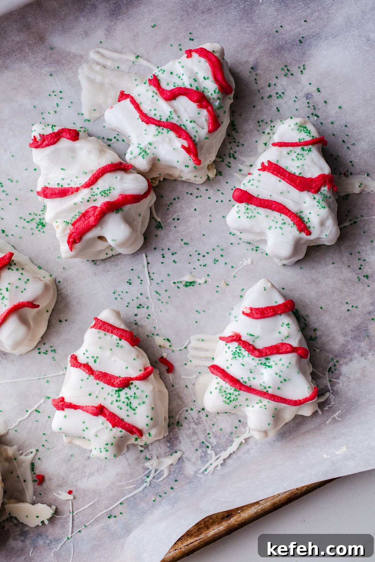 Little Debbie Christmas Tree Cakes Copycat Recipe for Holidays 14 Frosted christmas tree cakes on a baking sheet.