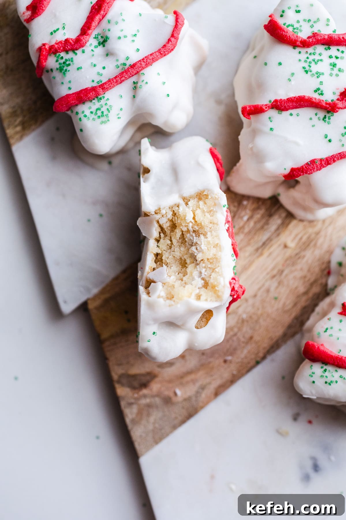Little Debbie Christmas Tree Cakes Copycat Recipe for Holidays 15 Christmas tree cakes on a serving platter.