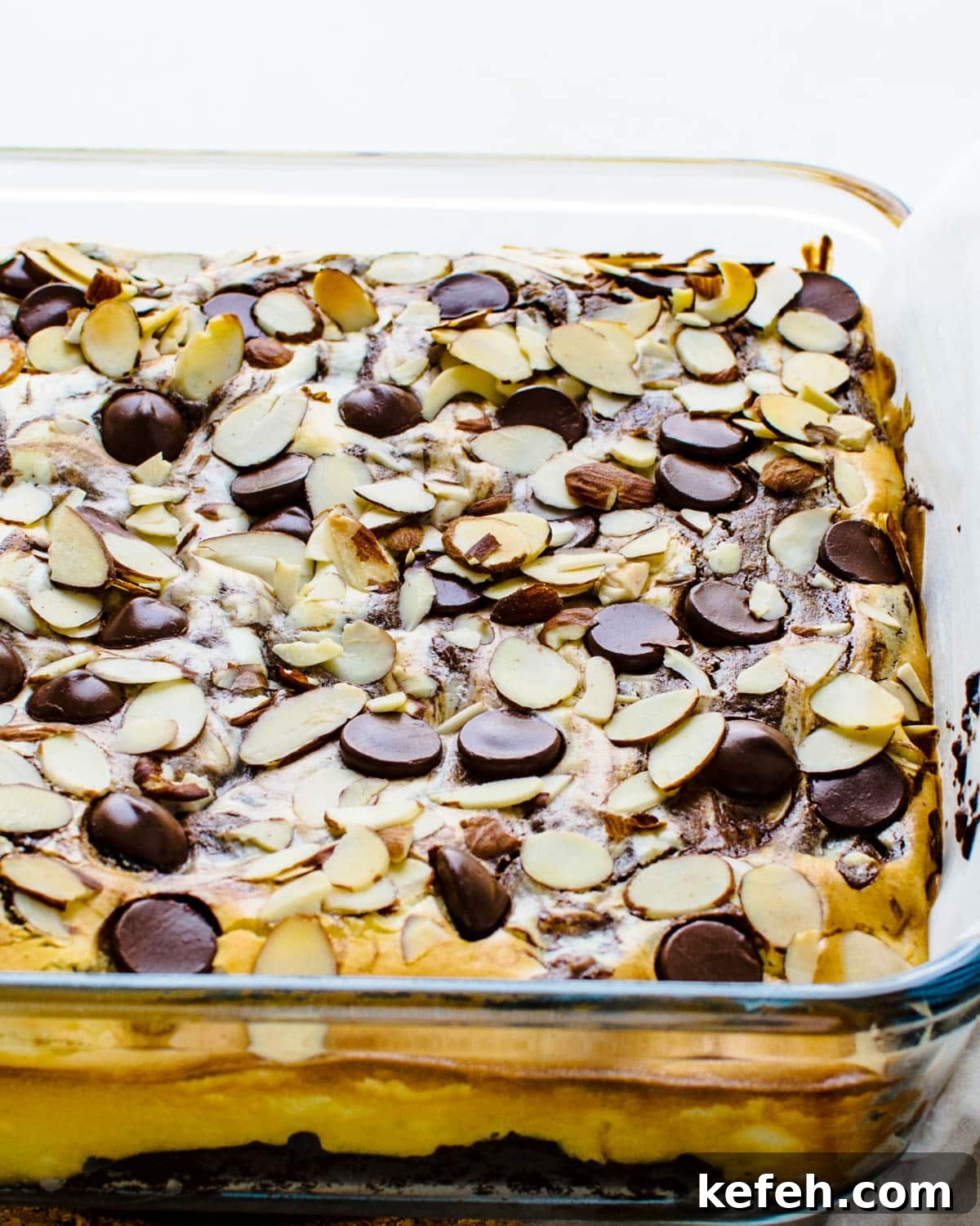 Decadent Cheesecake Brownie Squares: Fudgy Layers with Cream Cheese Swirl 9 Baked cheesecake brownies.