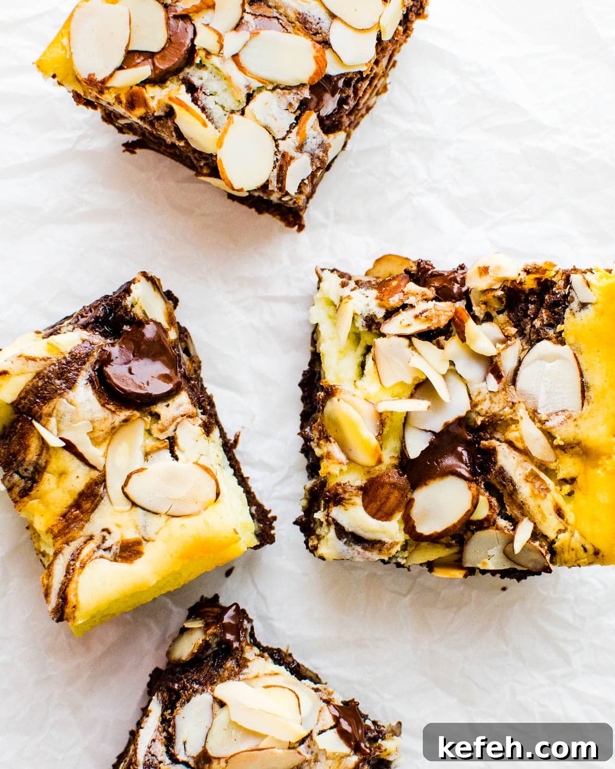 Decadent Cheesecake Brownie Squares: Fudgy Layers with Cream Cheese Swirl 10 Cutting cheesecake brownies.
