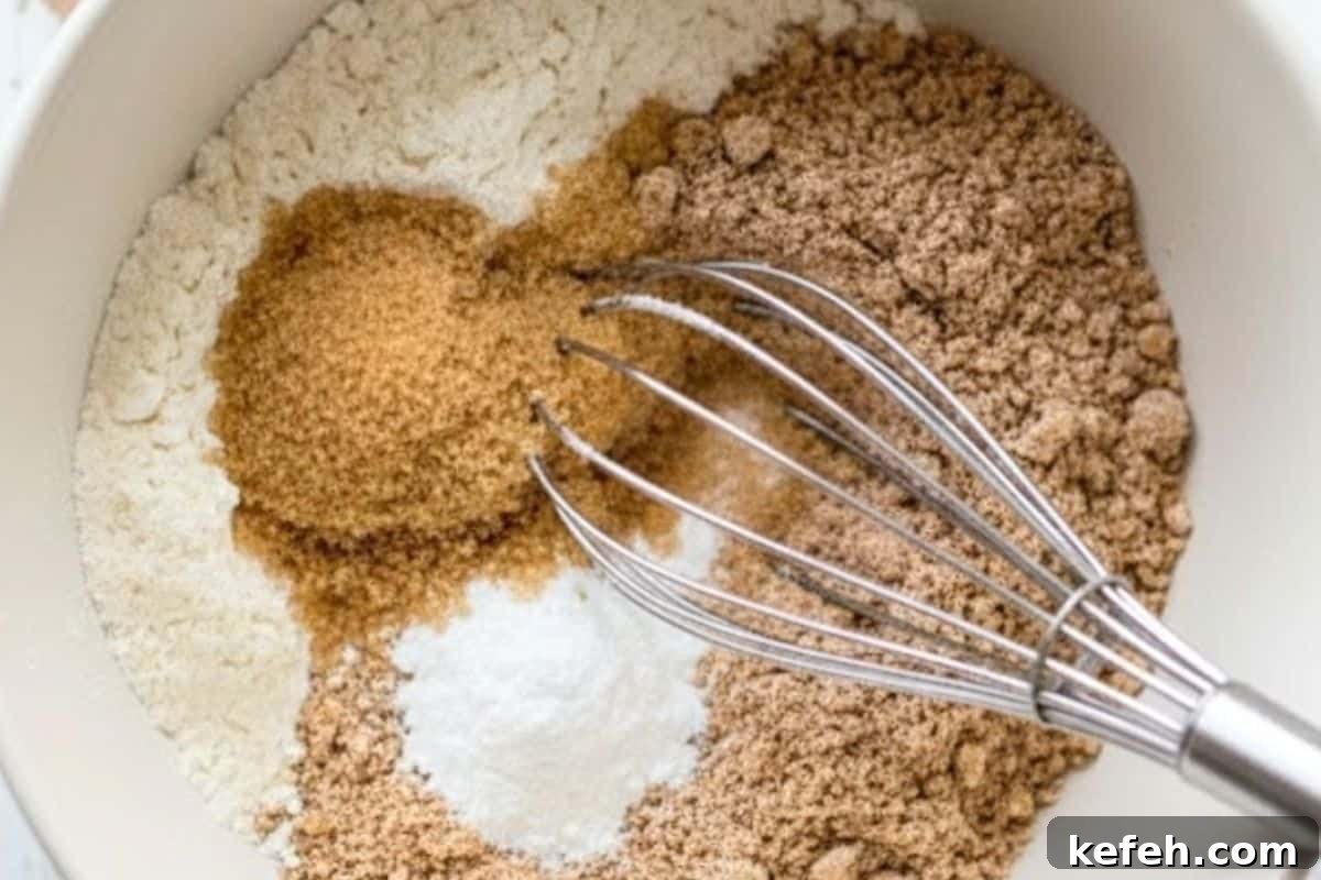 Add the flours, sugar or sweetener, and baking powder in a medium bowl.