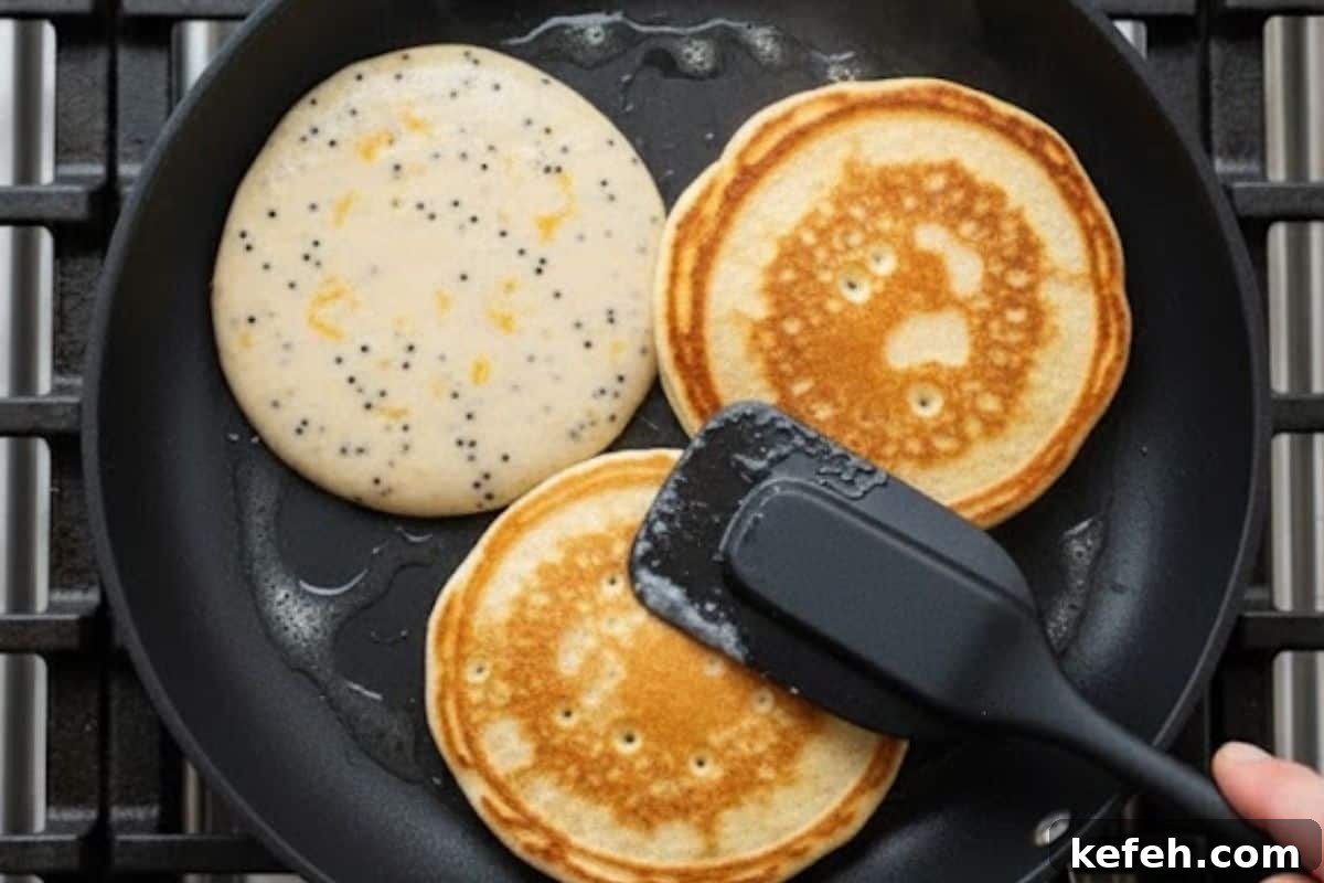 Scoop about one quarter cup of batter onto the pan, cook until golden.