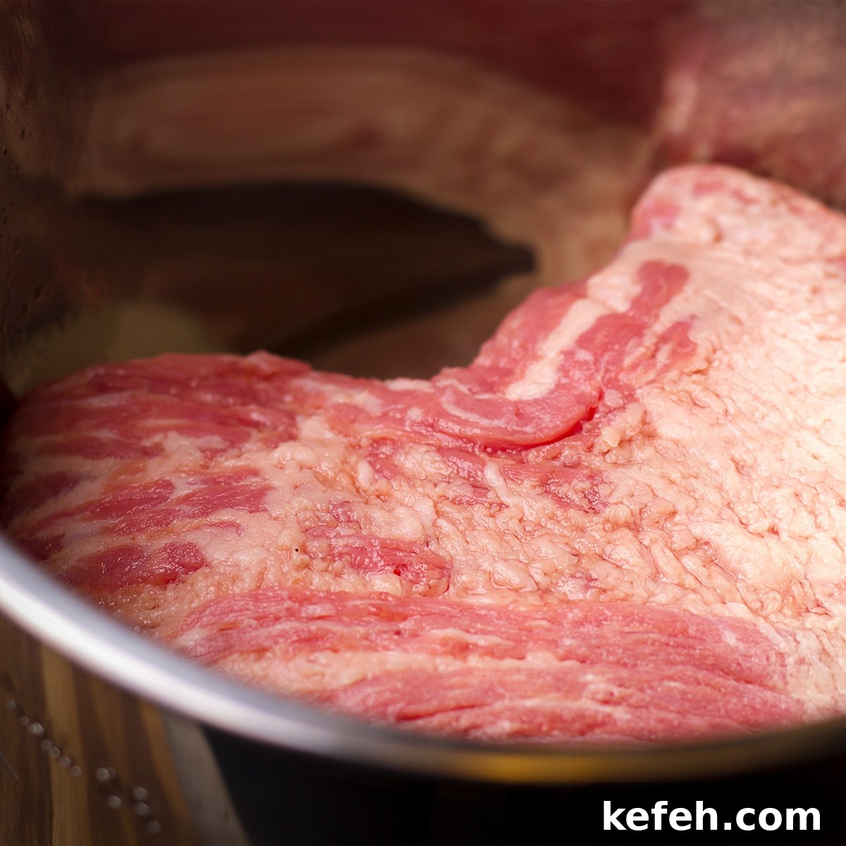 Corned Beef and Cabbage with Tangy Mustard Sauce (Instant Pot or Slow Cooker) 5 A corned beef brisket inside the bowl of an Instant Pot.