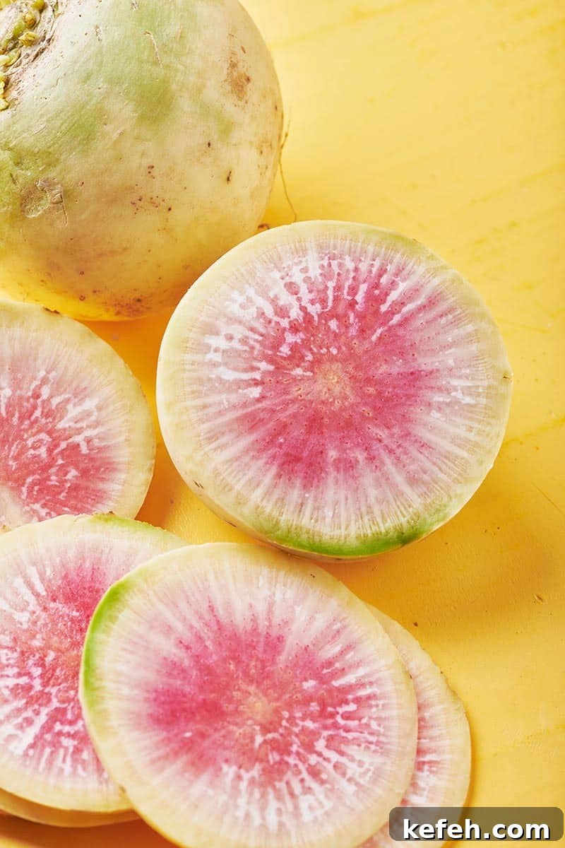 Cut watermelon radish on yellow table.