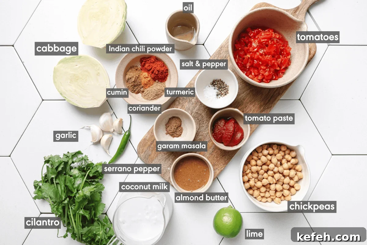 cabbage curry ingredients in various bowls on a white tiled table.