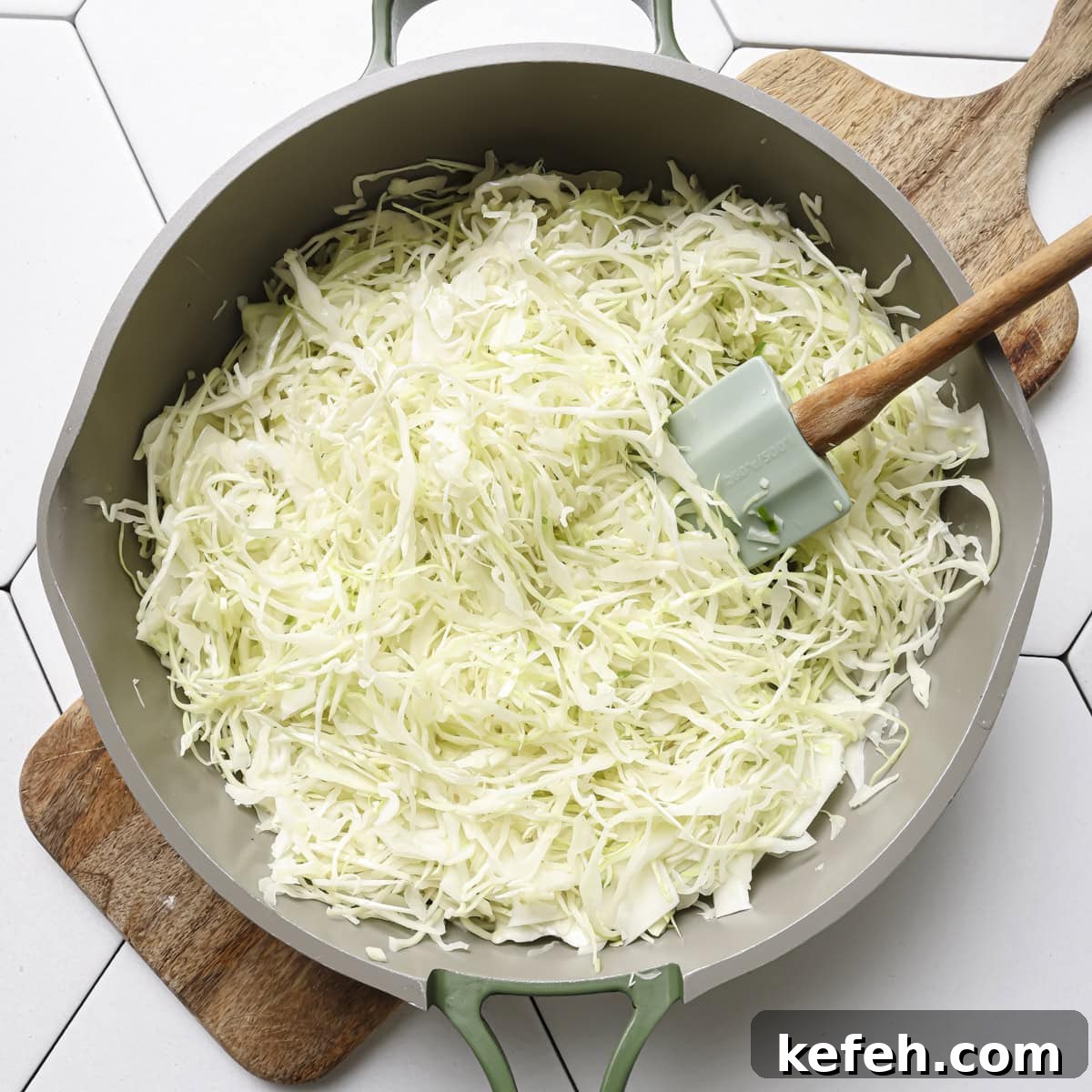 cabbage added to saucepan.