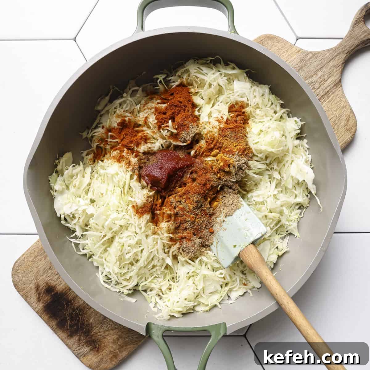 tomato paste and ground spices added to the cooked cabbage. 