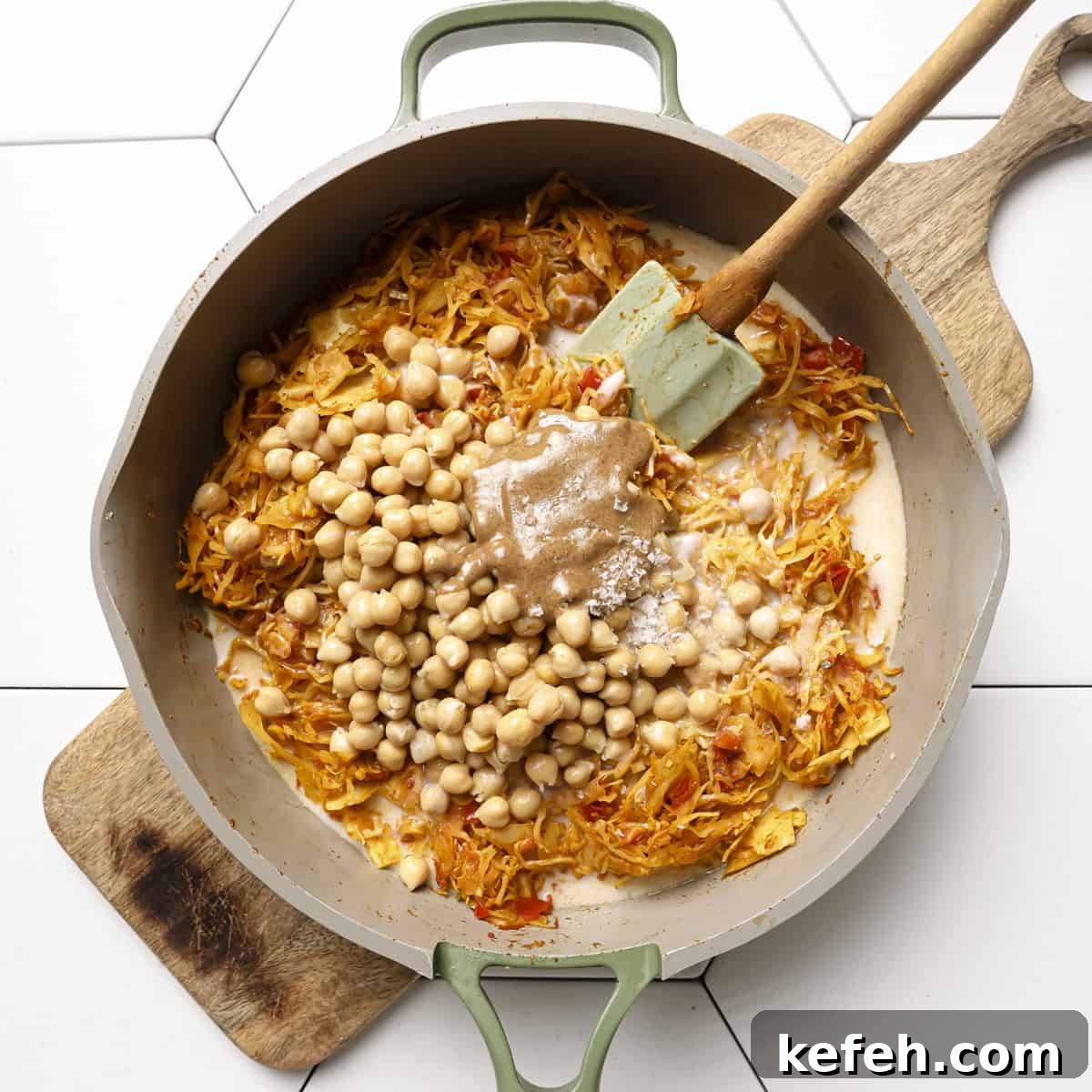 coconut milk, chickpeas, almond butter and salt added to the cabbage.