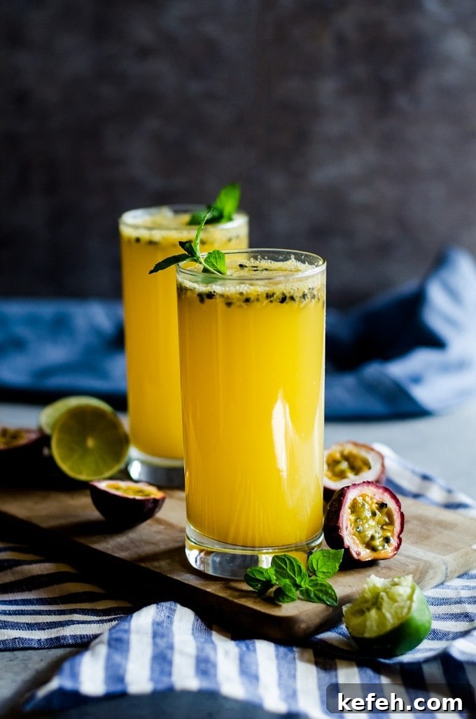 Passion Fruit Mojito Recipe: Refreshing Tropical Cocktail Guide 3 passion fruit mojito in glass with mint on cutting board