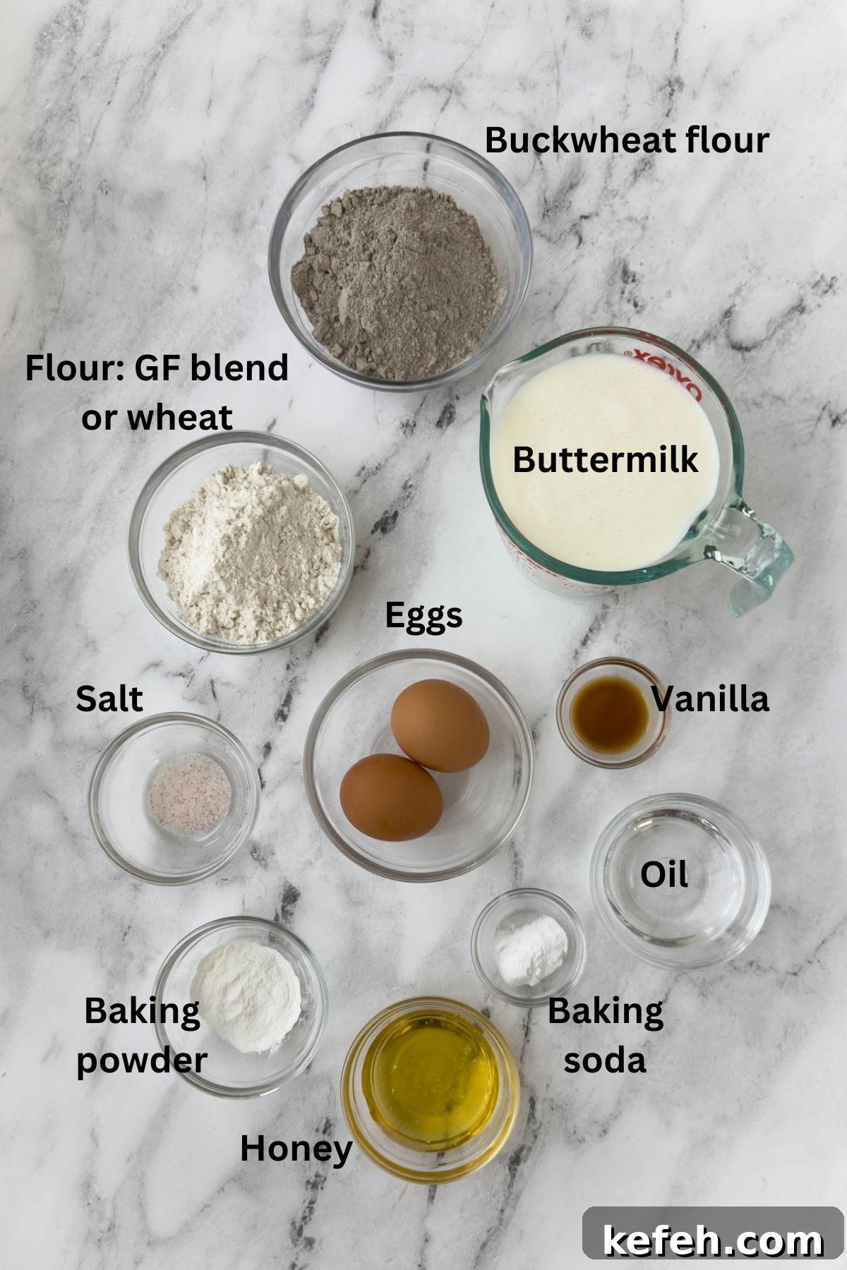 Ingredients for buckwheat pancakes in bowls ready to make batter.
