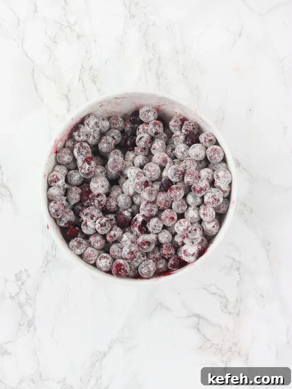 Blueberries coated with one tablespoon of all-purpose flour.