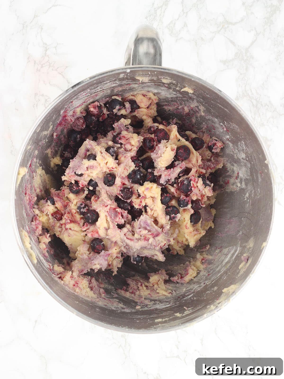 Buttermilk blueberry muffin batter after the blueberries have been folded in.