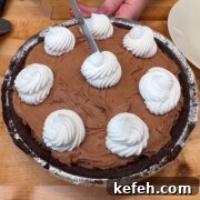 This no bake chocolate cheesecake recipe with cream cheese makes a cheesecake with a rich chocolate flavor and velvety smooth texture. It's so easy you'll want to make it for all of your get togethers!
