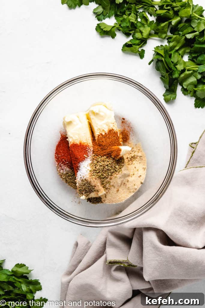 Softened butter and seasonings in a bowl.