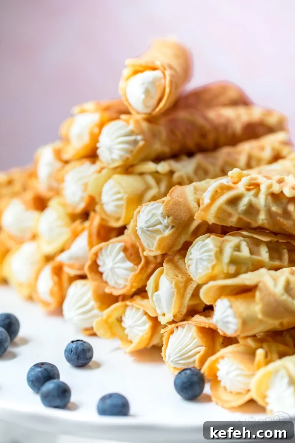 cream filled Pizzelles made from a Pizzelle maker then rolled and filled to trubochki 
