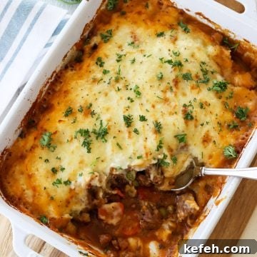 lamb mince shepherd's pie baked in a white casserole dish