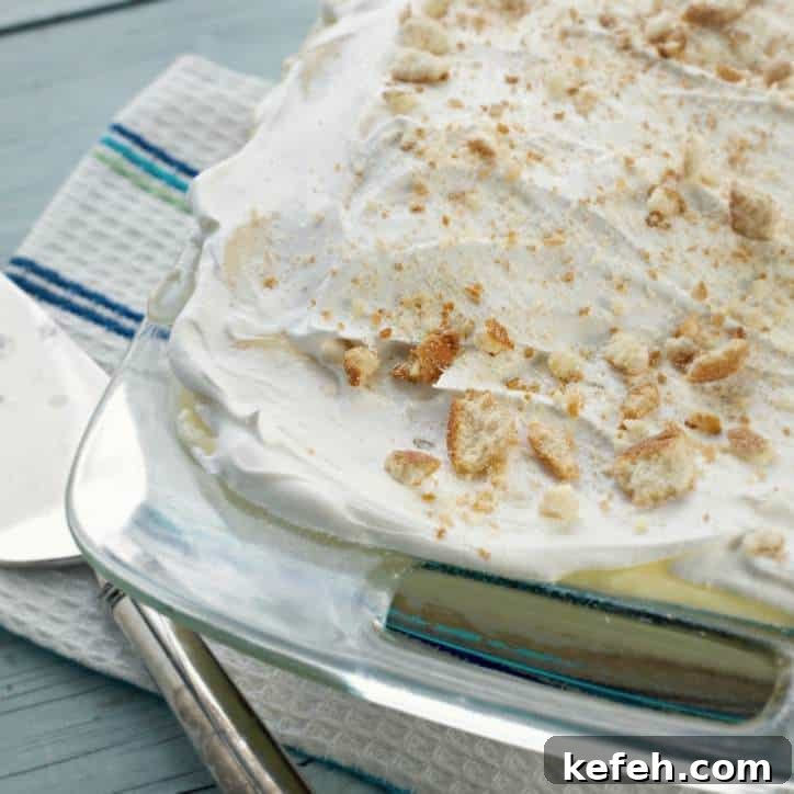 the corner of a 9x13 pan holding cake with cake server in background