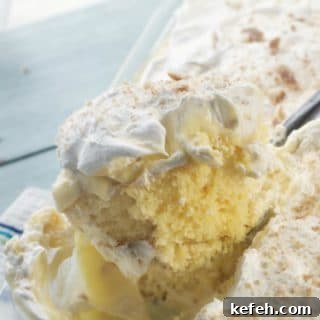 Banana Pudding Poke Cake scooped fully from the pan