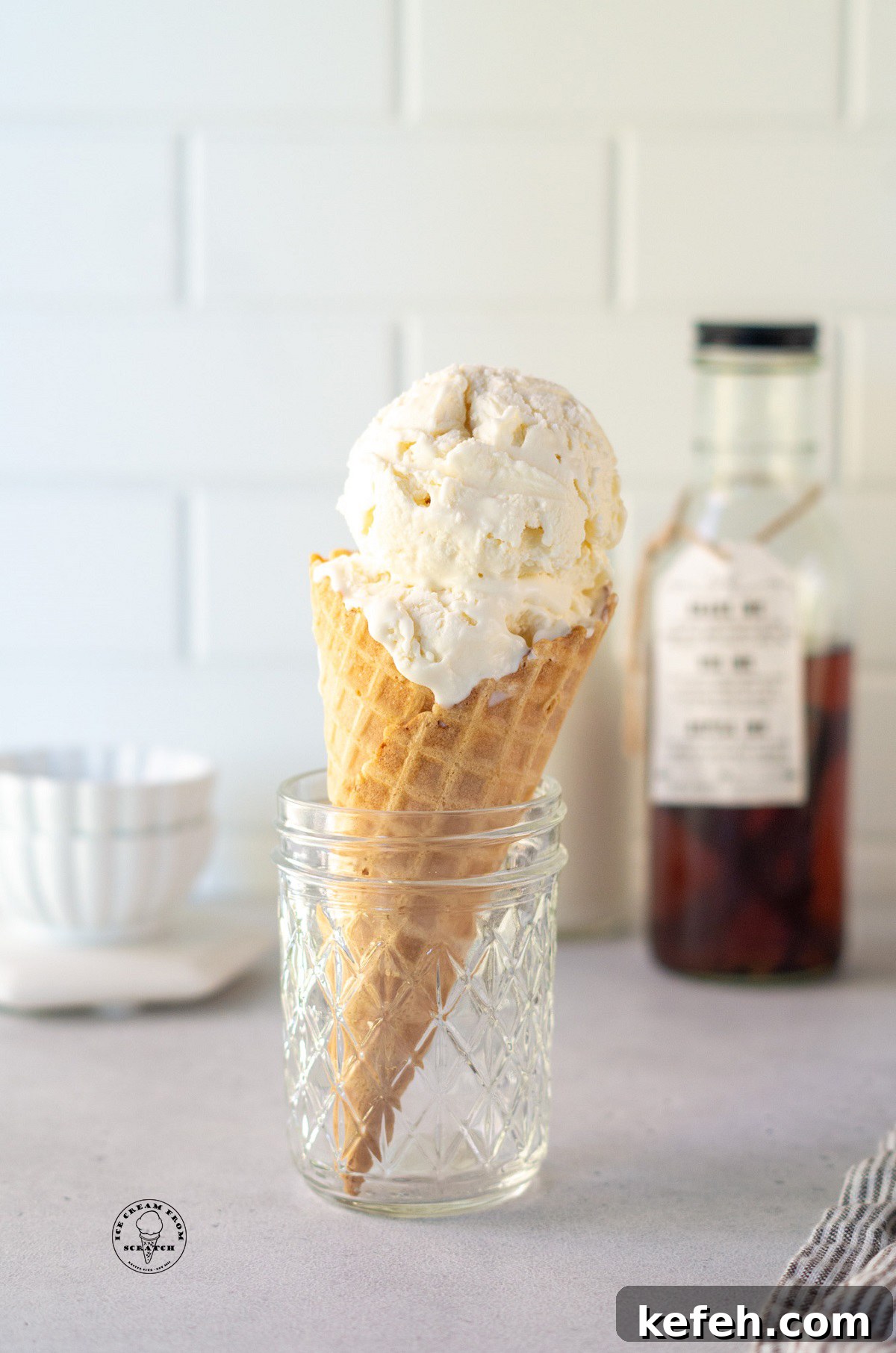a sugar cone filled with scoops of mexican vanilla ice cream.