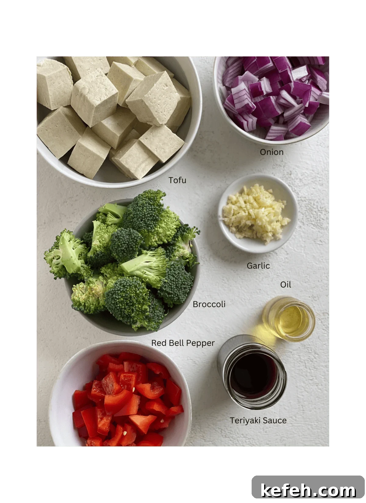 Quick Teriyaki Tofu Stir-Fry with Crisp Veggies 3 ingredients for Quick Teriyaki Tofu Stir Fry measured out against a white surface
