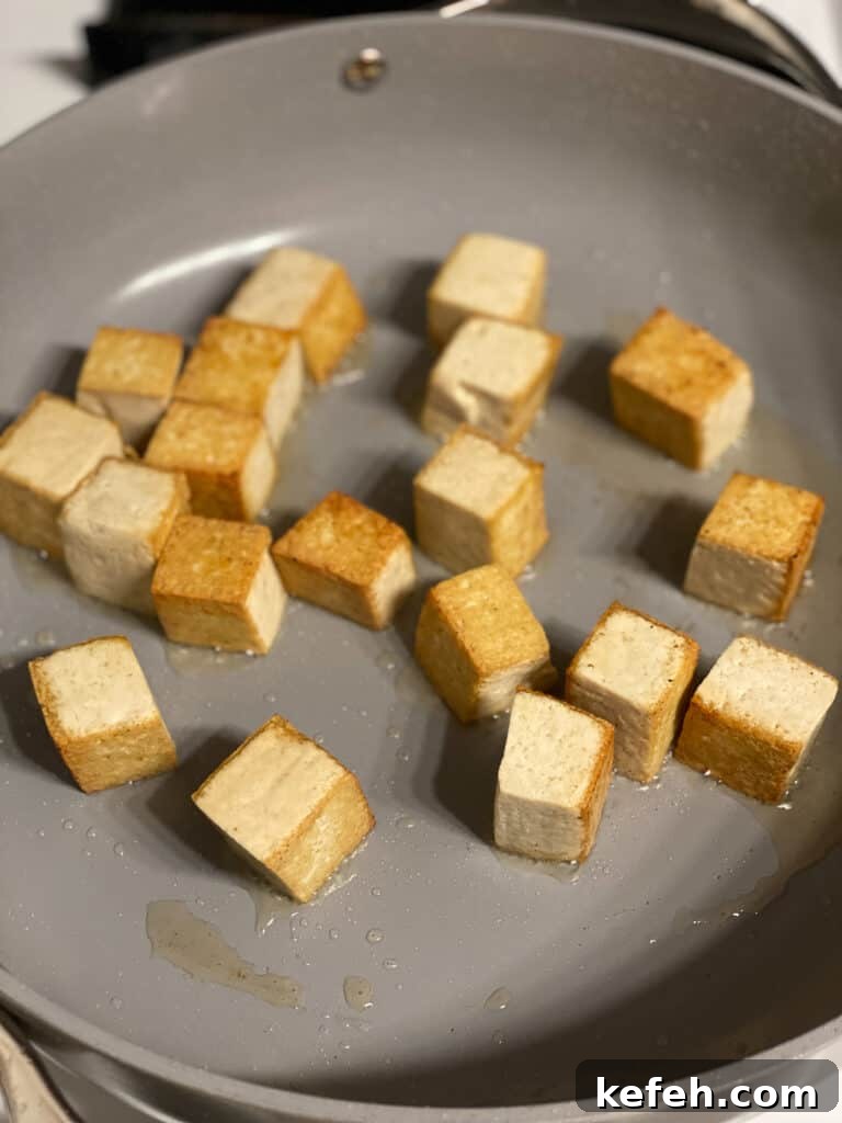 Quick Teriyaki Tofu Stir-Fry with Crisp Veggies 4 process shot of tofu cooking in pan