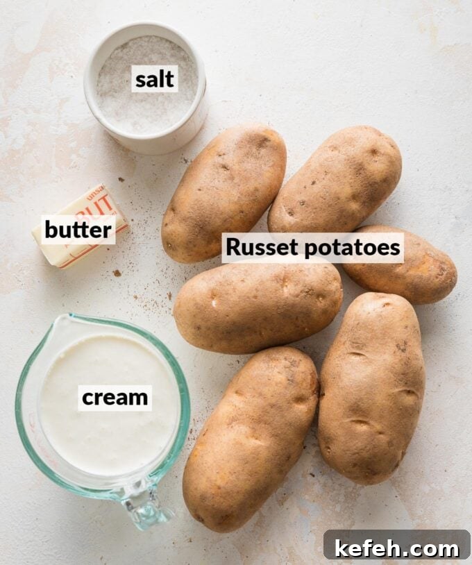 Labeled overhead photo of Russet potatoes, cream, butter, and salt.