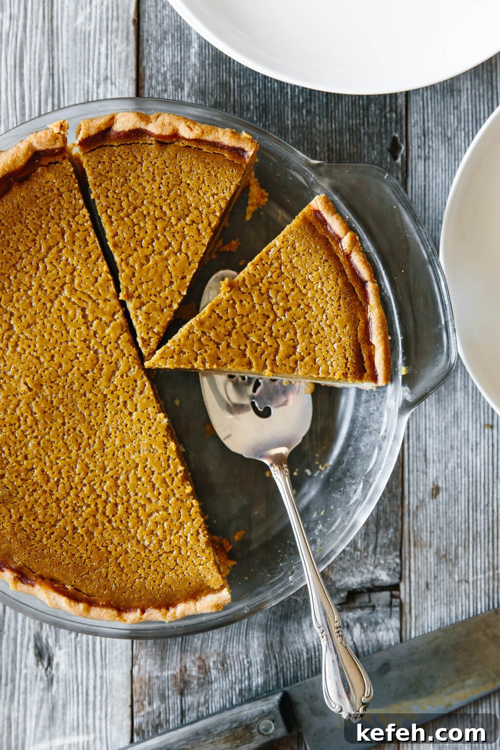 25+ Unique Thanksgiving Dessert Ideas to Impress Your Guests 8 Slicing up a paleo pumpkin pie.