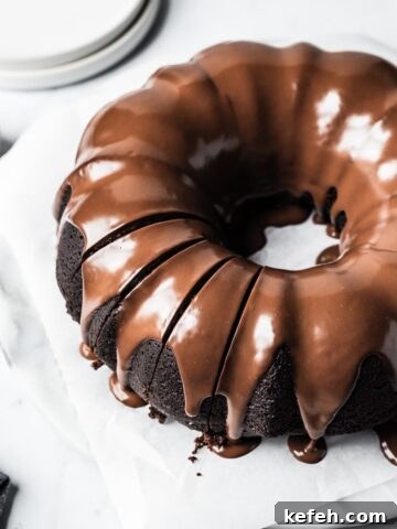 Close up of sliced chocolate bundt cake.