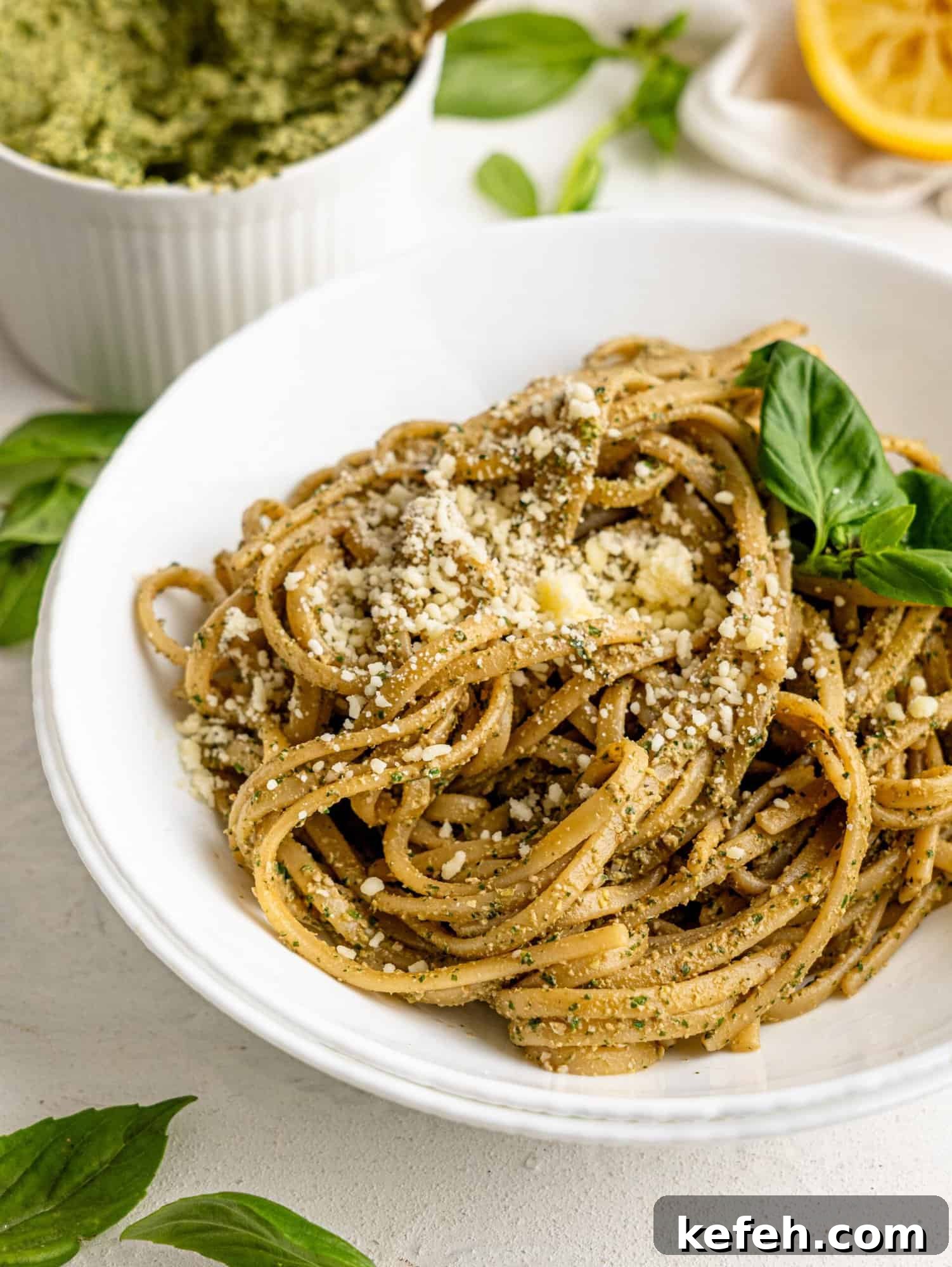 Sunflower Seed Basil Pesto Recipe — Nutritious Homemade Sauce 11 Pesto Pasta in a white bowl.