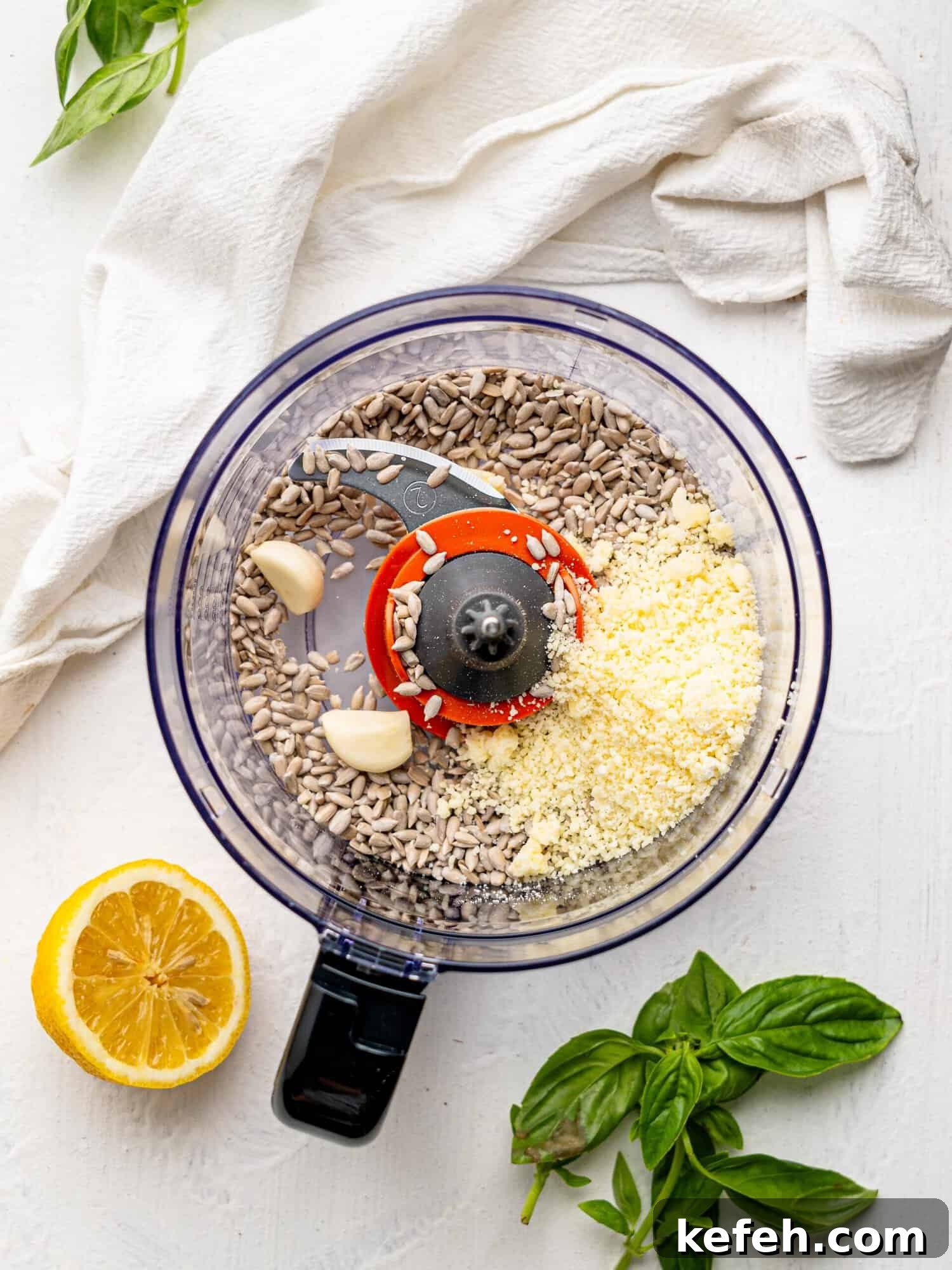 Sunflower Seed Basil Pesto Recipe — Nutritious Homemade Sauce 7 Sunflower Seeds, garlic and parmesan in a food processor.