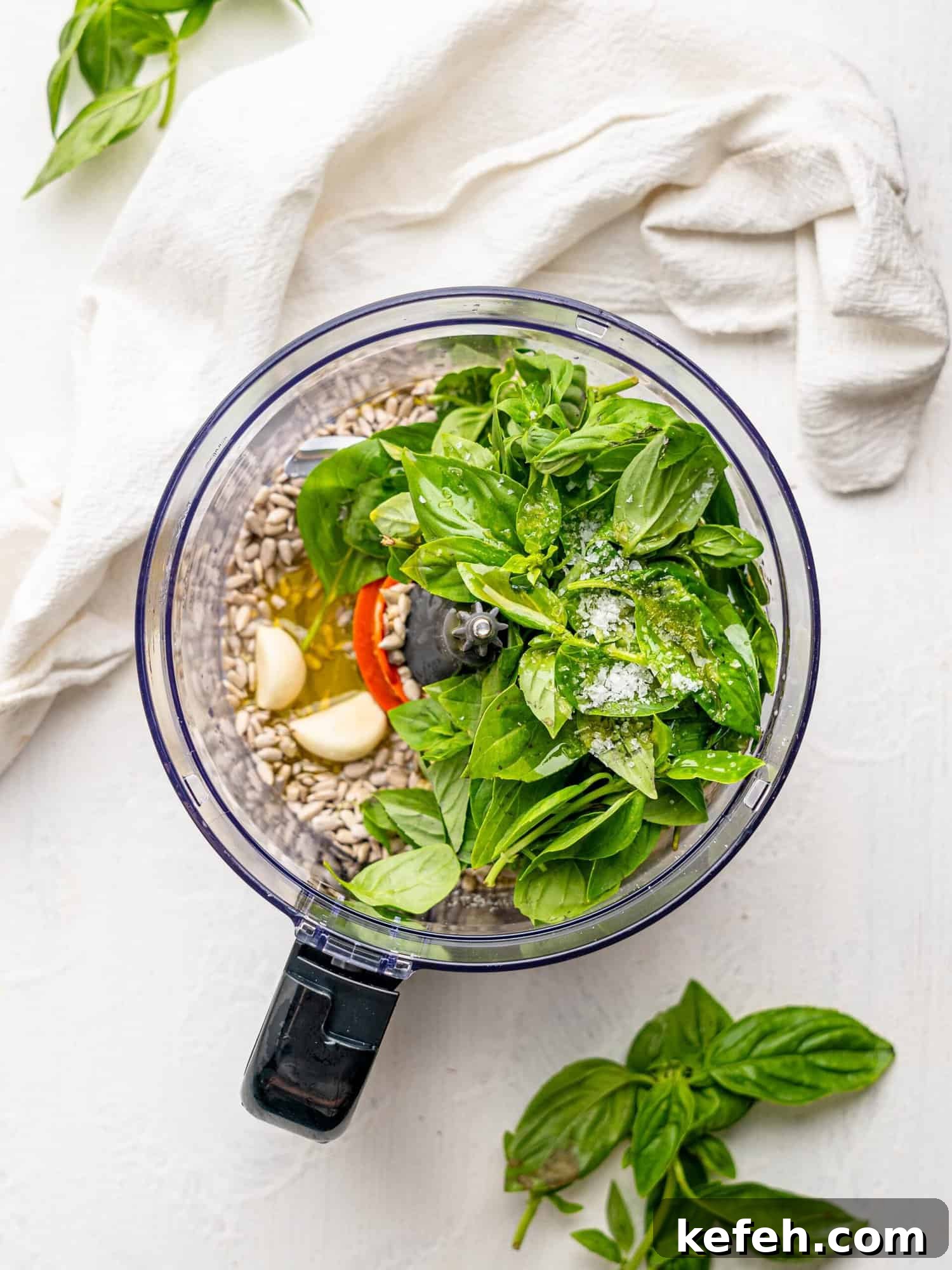 Sunflower Seed Basil Pesto Recipe — Nutritious Homemade Sauce 8 Imgredients for sunflower seed pesto in a food processor.