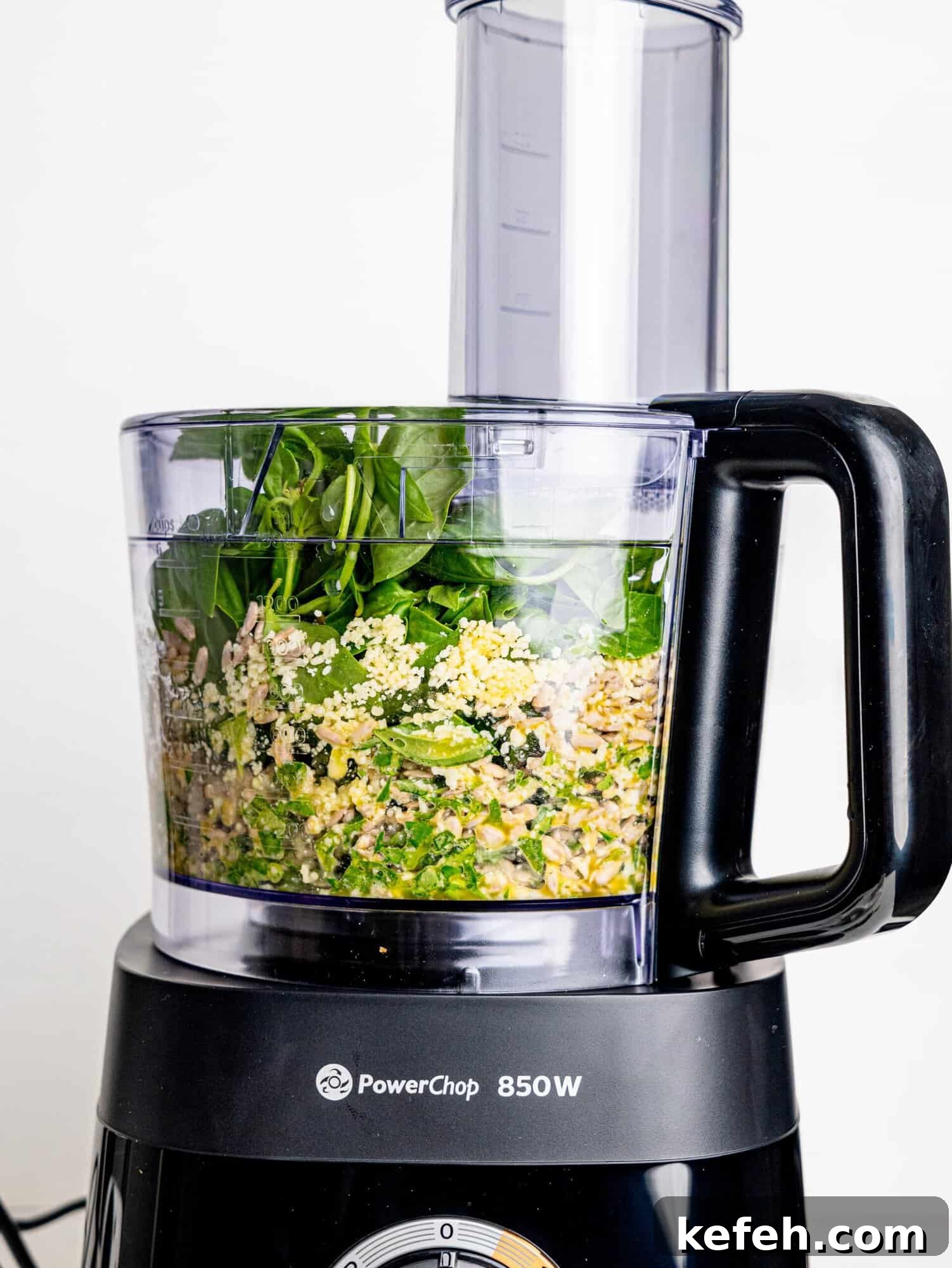 Sunflower Seed Basil Pesto Recipe — Nutritious Homemade Sauce 9 Blending sunflower seed basil pesto in a food processor.