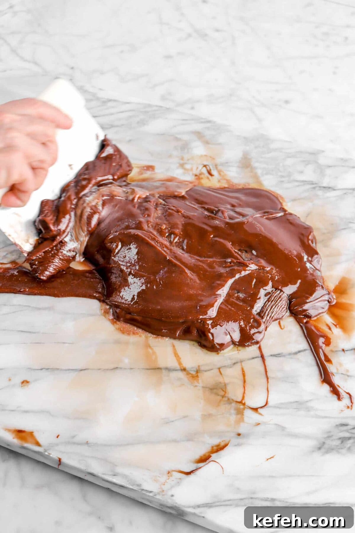 butter being folded into chocolate.