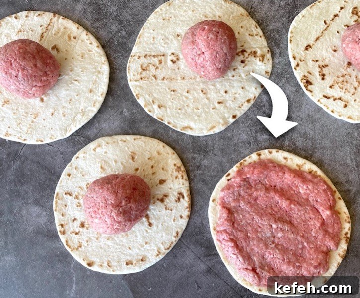 How to make Smashed Cheeseburger Tacos! Simply smash raw ground beef into a thin layer on flour tortillas and cook on a Blackstone griddle or pan on your stove. 